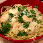 Shrimp scampi in a red bowl