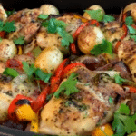 Roasted chicken thighs, sausage, peppers and potatoes