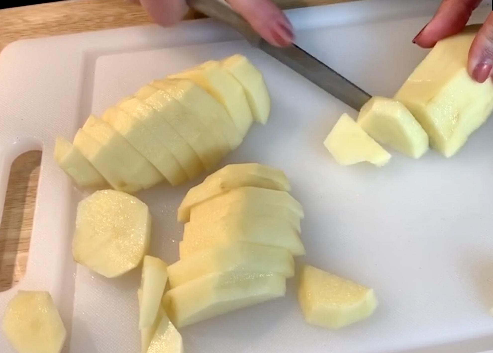 Slicing Potatoes on cutting board