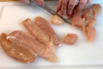 Slicing Chicken on cutting board