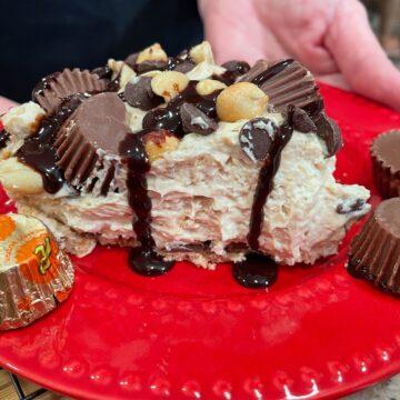 No Bake Peanut Butter Pie drizzled in chocolate and Reese Peanut Butter Cups