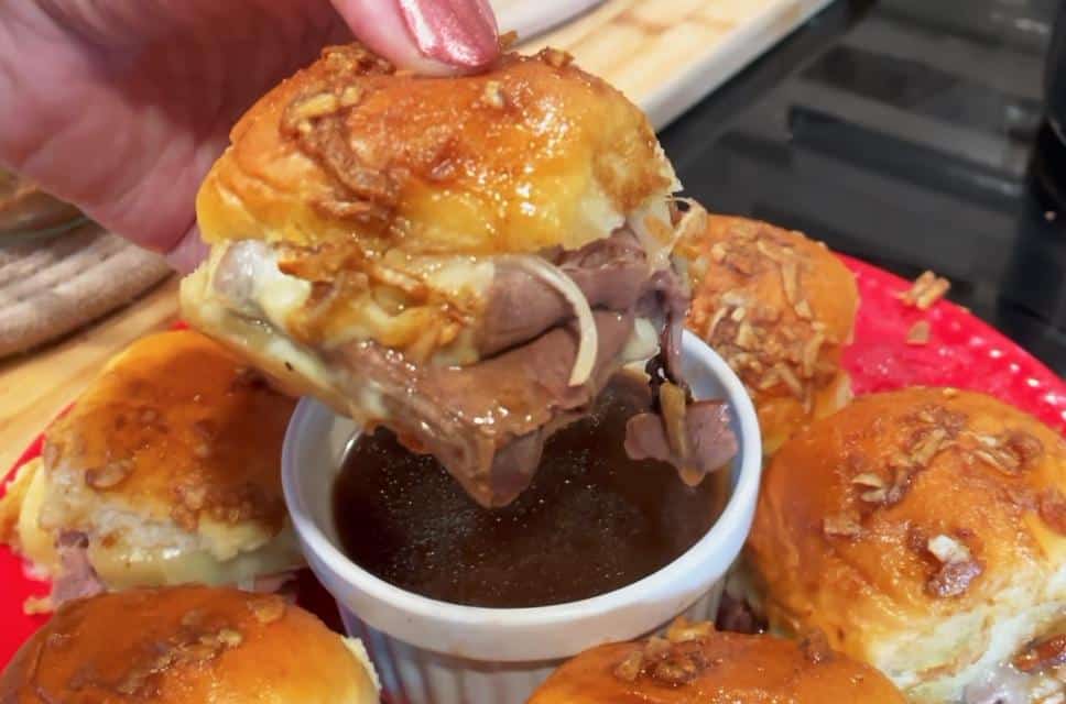 French Dips on a plate dipping into Au jus